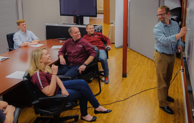 image of new eagle employees in a meeting